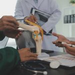 group doctors reading document meeting room hospital 1 Early Car Accident Treatment Latest vein treatments 2025 Wesley Chapel Spine and Sport Medicine