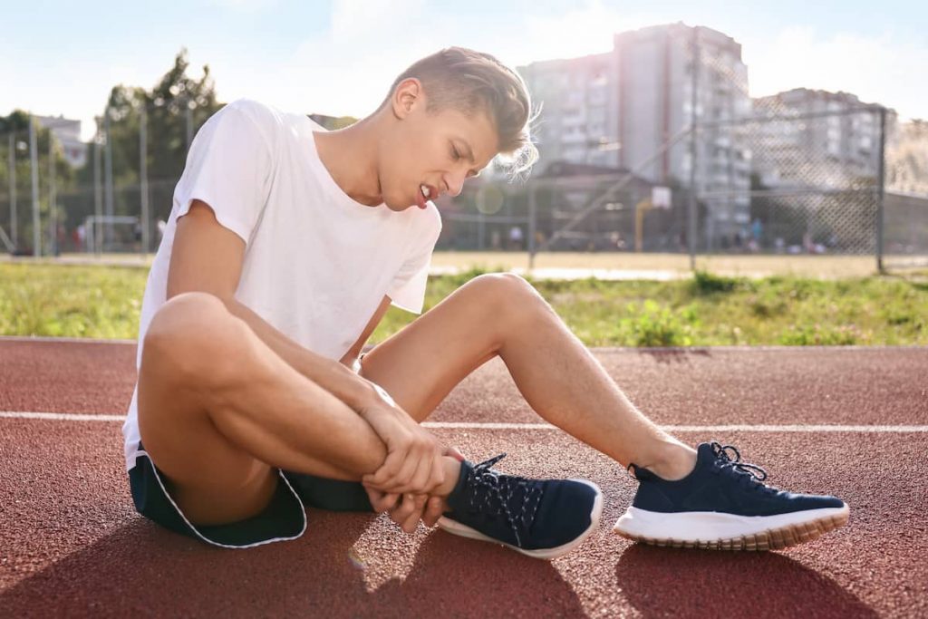 sports injury man suffering from leg pain stadium 1 Early Car Accident Treatment Wesley Chapel Spine and Sport Medicine