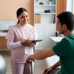 doctor helping patient rehabilitation 1 Personal Injury Service Supports Benefits of Low-Level Laser,pain management Wesley Chapel Spine and Sport Medicine