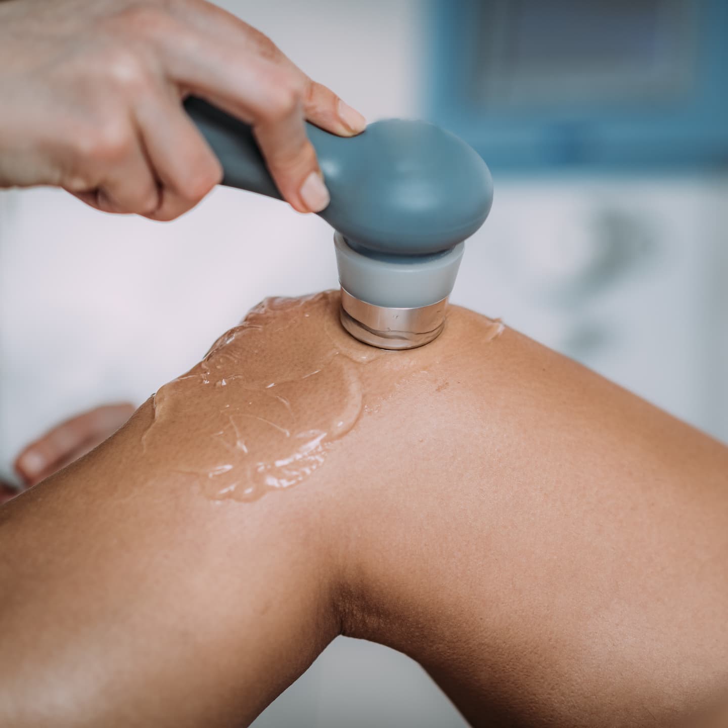 cropped hand doctor massaging patient knee hospital 1