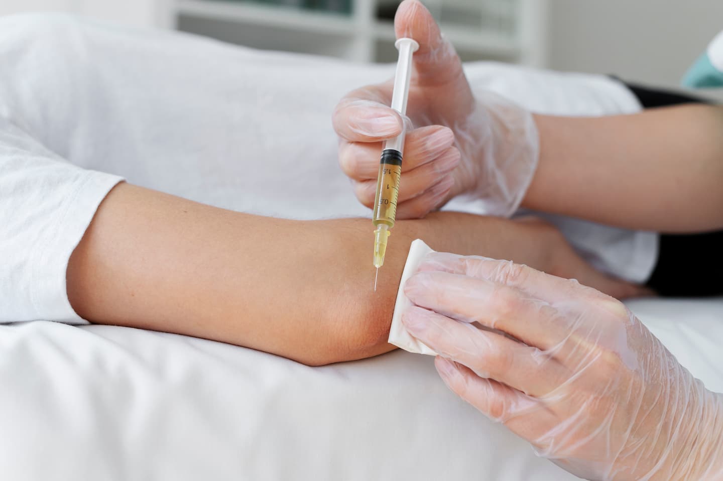 high angle patient getting elbow prp treatment 1