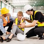 senior female engineer faints sick health problem accident workplace team staff helping support 1 chiropractic treatment after a workplace accident Electric Muscle Stimulation,benefits of EMS in rehabilitation,accelerate recovery with electric stimulation Wesley Chapel Spine and Sport Medicine