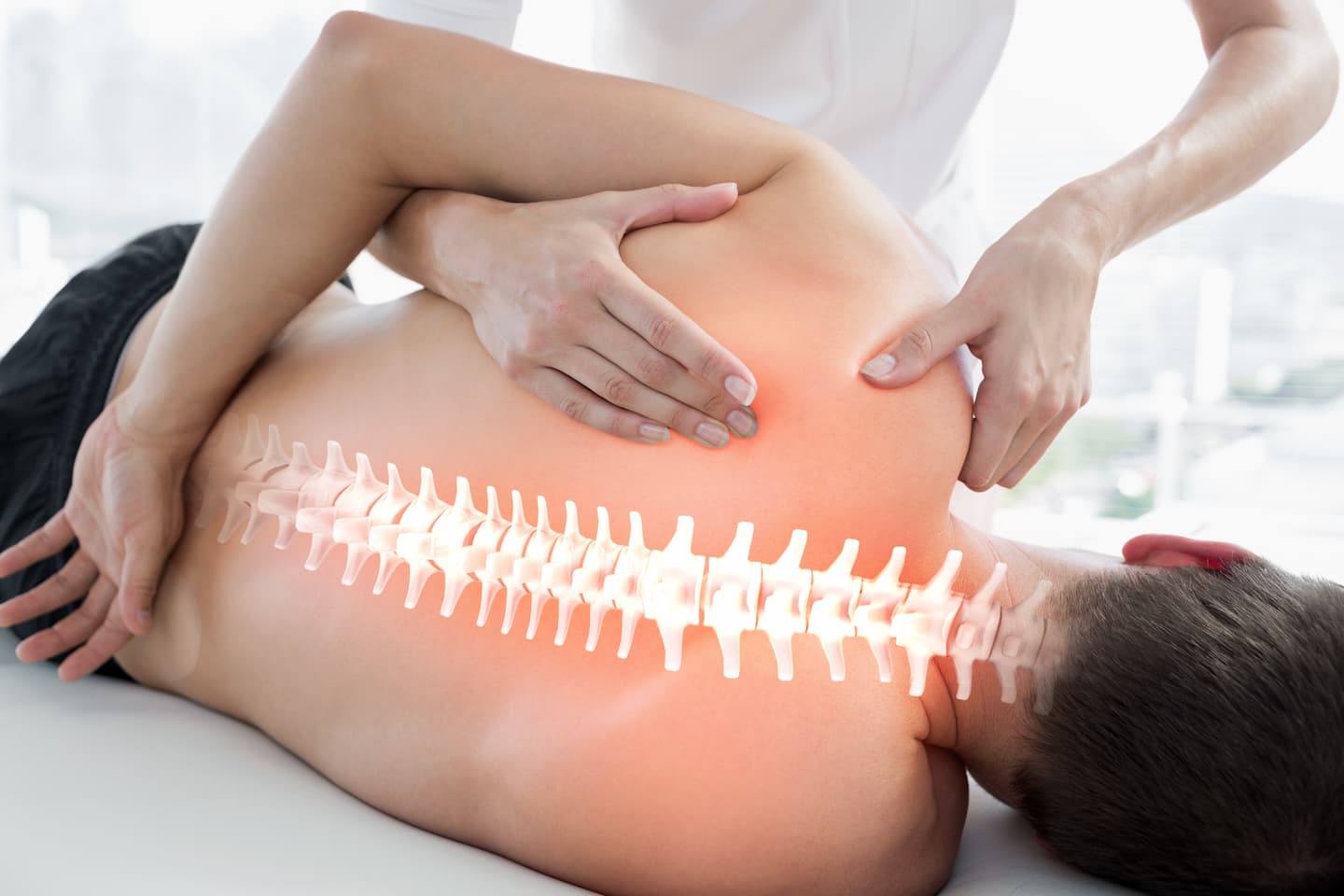 woman with back pain is touching back her back 1